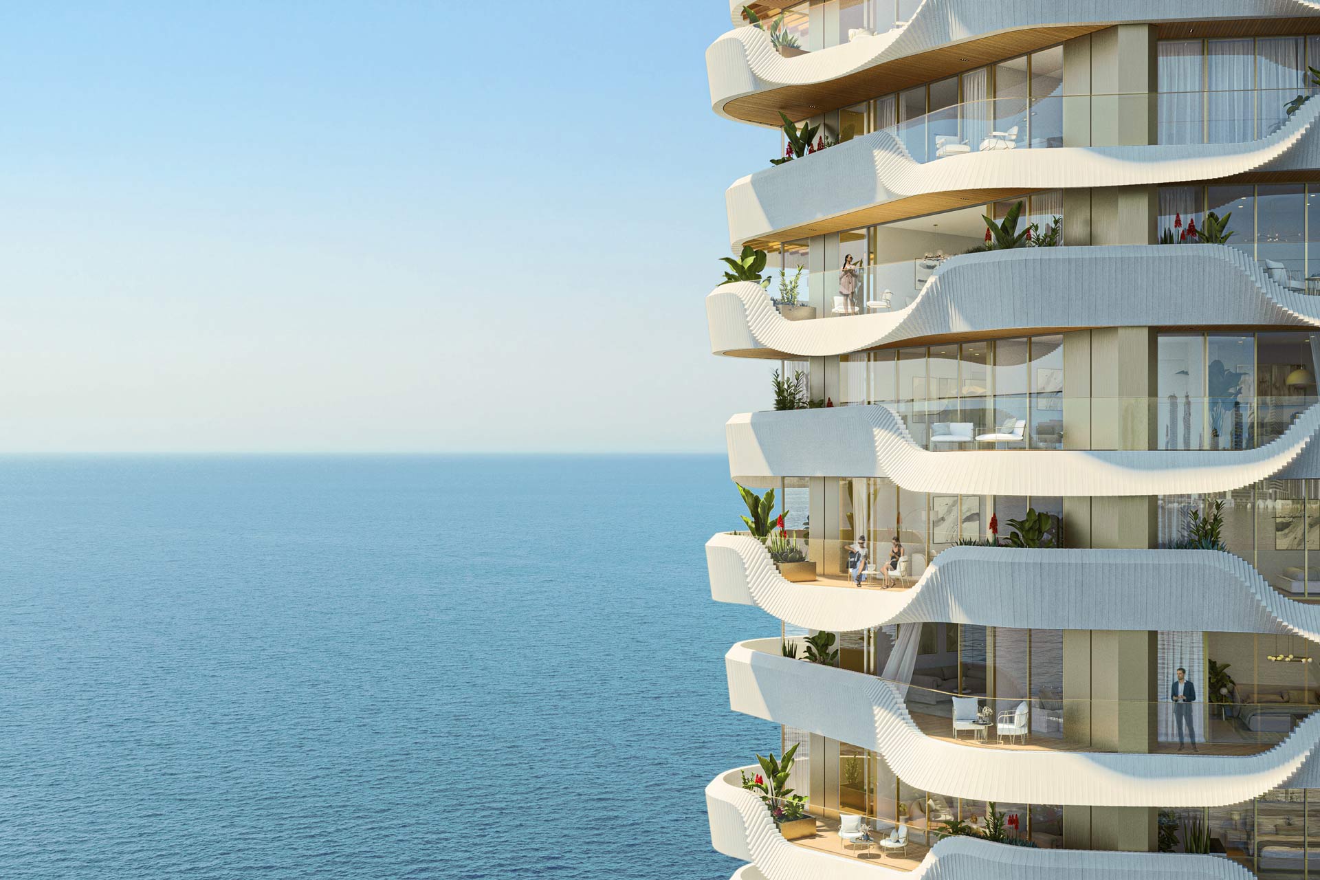 Azure Tower designes by UNStudio overlooking the ocean with a sweeping waterfront view, featuring modern architecture and lush green surroundings under a clear blue sky.